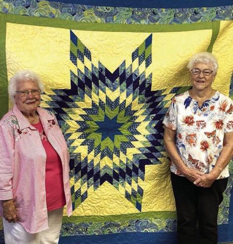 Twila Schuler, left, was the lucky winner of this year’s beautiful Dupree Volunteer Fire Dept. Auxiliary quilt. Each year, for the past 33 years, Virginia Till (right) has made and then generously donated a lovely quilt for the Dupree Volunteer Fire Department Auxiliary to raise funds with by doing a raffle during the Dupree Pioneer Days Celebration. Photo by Patty Peacock