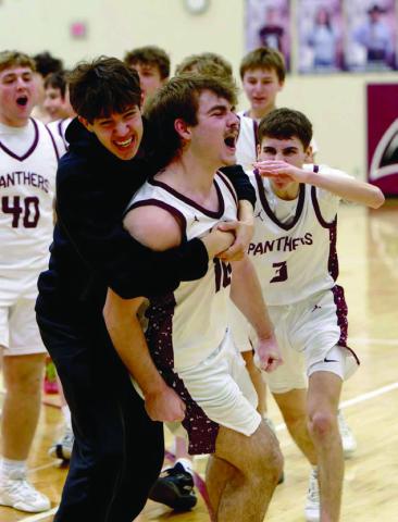 Treyden Beer (10, middle) gets mobbed by his teammates after draining a 15-foot buzzer-beater to give Timber Lake a 52-50 win over North Central on Saturday, Jan. 31. Included in the celebration were Mason Bickel (40), Braden Lawrence (3), and Jackson Bigger (in black). Topic Photo/Marie DuPreez