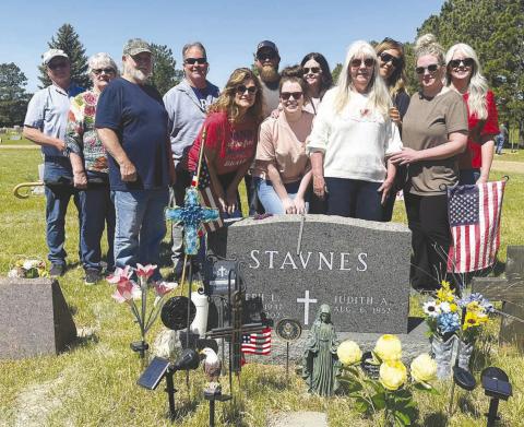 The Stavnes family gathered at the Timber Lake Cemetery where the late Joe Stavnes was recognized with a salute by the American Legion on Memorial Day. Front (l to r): Mark Stavnes, Heidi Stavnes, Jordan Fullmer, Judy (Mrs. Joe) Stavnes, Caitlin Nation; back: Guy Stavnes and his wife Diane, George Stavnes, Ryan Fullmer, Jodi Fullmer, Michele Bullock and Shawn Willson. Joe, Guy, Mark and George are sons of the late Sig and Aileen Stavnes. Photo by Kathy Nelson