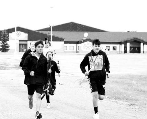 Oyate Isnala runners leave from Tiospaye Topa School at LaPlant
