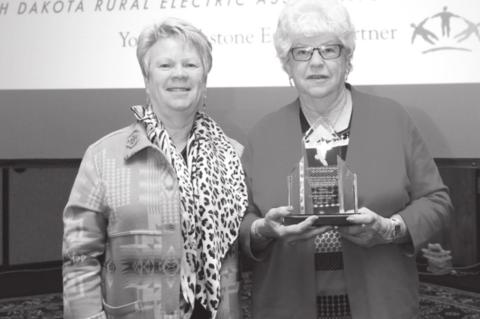AT RIGHT: Beverly Birkeland with her Legacy of Leadership Award, with Moreau-Grand Manger Melissa Maher (LEFT).