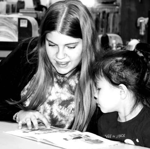 Dupree NHS member Dustilyn Lemke reading to a PreK student