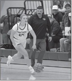 Maddy Hermes brings the ball upcourt while Timber Lake coach Tuffy Thompson gives her instructions during Panther basketball action against new Underwood. Topic Photo/Marie DuPreez