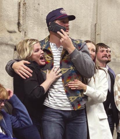 TLHS alum Tucker Kraft embraces his mother (left), Tausha, and fiance, Baylee Jandahl, as his name is announced as the 78th selection in the 2023 NFL Draft. The SDSU tight end was picked by the Green Bay Packers. Watching the announcement at right are Kraft’s brothers, Tanner and Cody. Photo by Jon Flatland