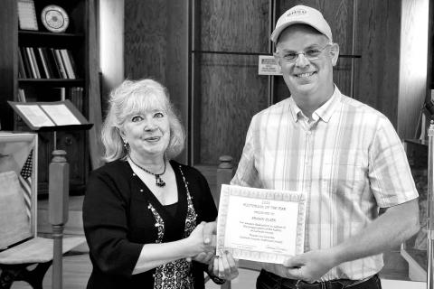 LEFT: Kim Shannon (left) presents Shawn Olsen with the Historian of the Year award.