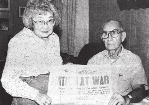 Jim and Mary Byington with the front page of the Sheridan Press