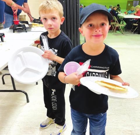 AT RIGHT: Two of John and Patty Linderman’s grandsons enjoyed the pancakes and (Grandpa John’s) sausage. Oliver McComsey (LEFT) is from Aberdeen and Ashton Linderman is from Carrington, ND.