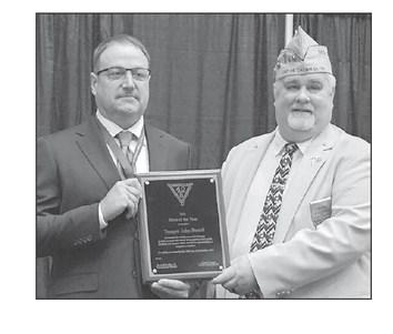 Chef de Chemin de Fer Frank Campo, right, National President of the Society of the Forty Men and Eight Horses, presents the Hero of the Year award to Trooper John Berndt last month. Berndt is a 1997 graduate of McIntosh High School.