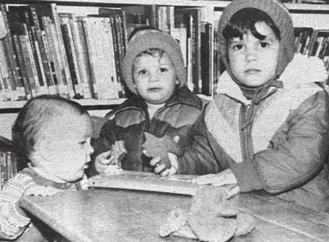 At the library Cassie, Beaman and Chasity Kraft munch on gingerbread men after the Christmas movies at the library Saturday. About 20 children and mothers attended the showing. Cassie and Chasity are the daughters of Mike and Donna Kraft. Beaman is the son of Dave and Mary Lou Kraft. Timber Lake Topic, December 24,1981
