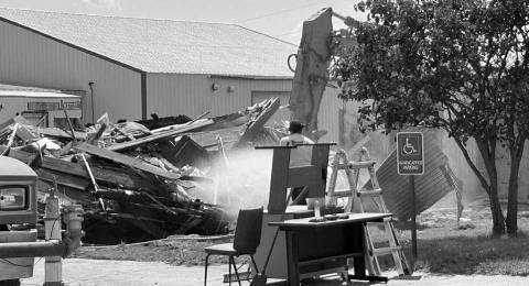 A building that had housed several businesses on Isabel’s Main Street, including a candle shop, was demolished on July 1.