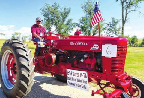 Jim Keller (driving)restored this 1954 Super M-TA that Baldwin Keller purchased new at Hulm Chevrolet.
