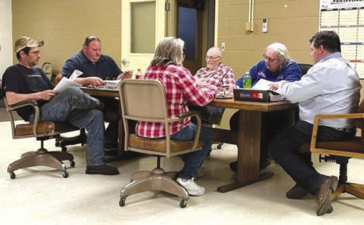 Members of the town of Isabel’s Board of Trustees discuss an estimated $2.1 million wastewater infrastructure improvement project on Monday, May 15. Members include, L-R, Clint Doan, Vice-President Daryl Pfaff, Judy Gifford, Darrel Burke, Finance Officer Karla Nordyke, and President Ryan Maher. Photo by Jon Flatland
