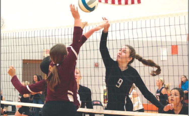 Battle at the Net Timber Lake’s Sara Holzer (9) battles an unidentified McIntosh player at the net during the Mobridge-Pollock Volleyball Invitational held Saturday, Sept. 9, at Mobridge-Pollock High School. The Panthers finished the day going 2-2 and moved their overall record to 4-5 on the season. Photo by Jon Flatland