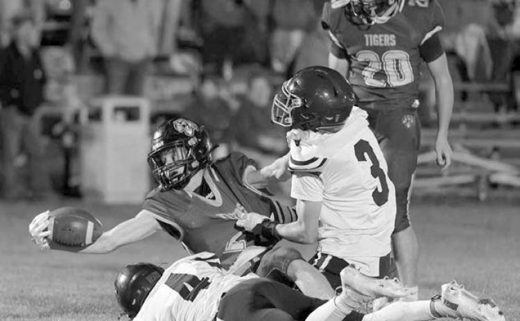 Dupree running back Cruz Birkeland (2) stretches for a first down while being tackled by Timber Lake’s Broc Bauer (4) and Holden Gill (3). Dupree’s Michael Donavon (20) looks on. Birkeland scored two rushing touchdowns in a 38-6 victory over the Panthers last Friday, Oct.17. Photo by Marie DuPreez