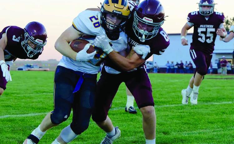 Kolby Holzer lays a hit on a Herreid-Selby running back in a game earlier this season. Keller is a formidable member of the Panther offense and is one of its leading tacklers. Photo by Marie Dupreez