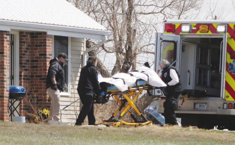 Emergency Medical Technicians remove the body of 25-year-old Eden One Feather of Little Eagle from House 449 on D Street in Timber Lake last Friday, April 14. Authorities discovered One Feather’s body after being dispatched to the residence for an unresponsive female. The FBI has taken over the case and No charges or names of two individuals taken into custody at the residence have been released by law enforcement or the U.S. Attorney’s Office. Photo by Jon Flatland