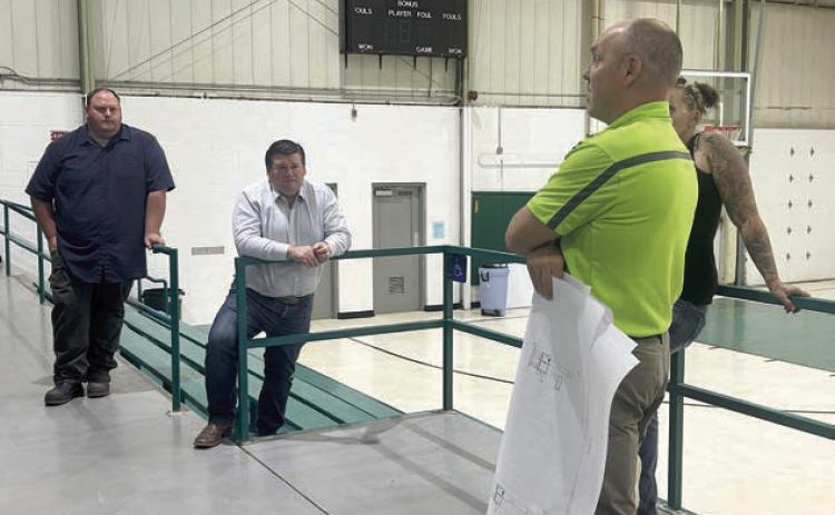 Isabel Board of Trustees members Darrel Pfaff (left) and Ryan Maher (center) discuss HVAC improvements at the Isabel Community Center with Travis Sichmeller of Sichmeller Engineering of Aberdeen. The board approved moving ahead with acquiring a complete estimate from Sichmeller for the proposed improvements. Photo by Jon Flatland