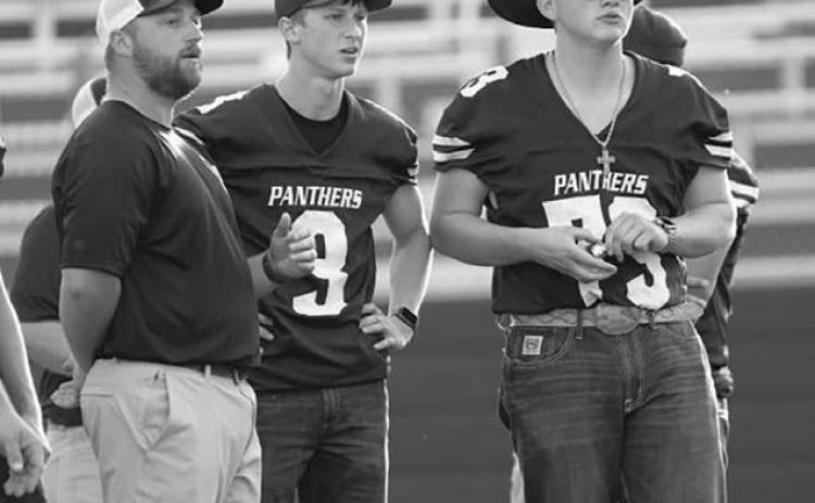 Braylen Hansen (73) watches the Panthers in action from the bench, where he has gone from player to coach. Photo by Marie DuPreez