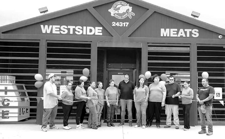 A ribbon cutting was held Friday, September 4 for the new Eagle Butte location of West Side Meats. The CRST Buffalo Authority Corporation also operates West Side Meats in Mobridge and West Side Meats C Store in LaPlant. Cheyenne River Sioux Tribe Chairman Ryman LeBeau (center) and CRST Council member Joseph Brings Plenty, Sr.(right) were among those participating in the ribbon cutting.