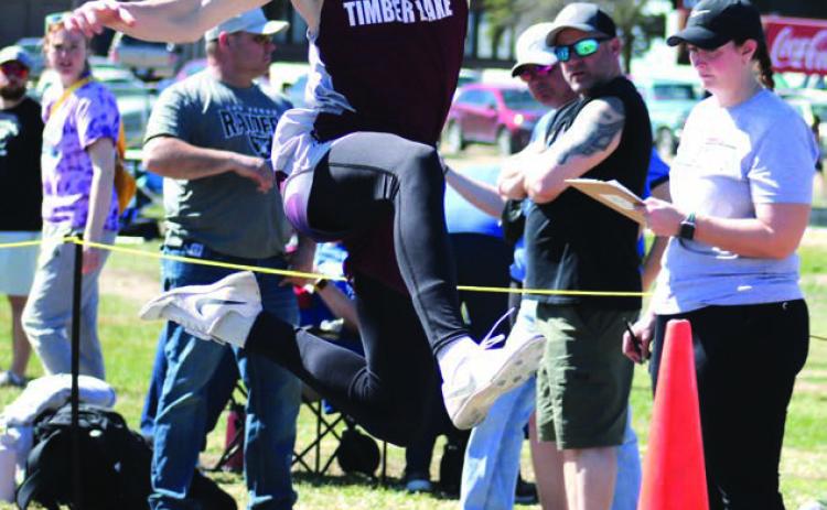 TJ Alley eyes his landing during triple jump competition at a recent outing in Mobridge. Timber Lake was slated to compete at the Ipswich Invitational on Saturday but it was cancelled due to high winds and low temperatures. Photo by Jon Flatland