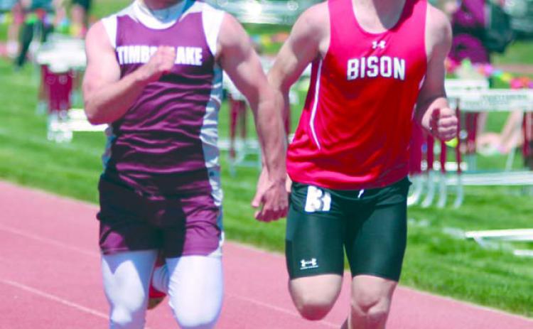 Timber Lake senior Jayden Miller edged Bison’s Rylee Veal at the finish line of the 100 meter run during the Region 8B track meet last Friday, May 19. Miller won the region title and qualified for the State track meet this weekend in Sioux Falls. Photo by Jon Flatland