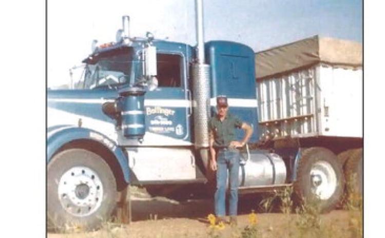 Gene Bollinger poses with one of his trucks during the 1970s. Bollinger Trucking is celebrating 70 years of service this weekend.