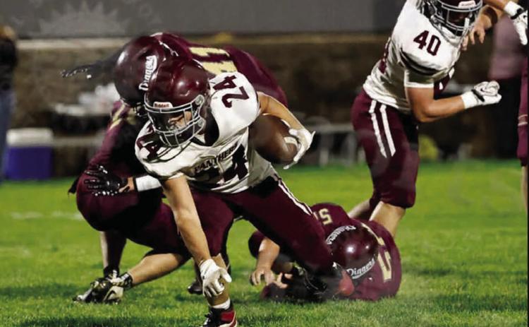 Running back Blaise Lei shakes a pair of would-be defenders to score a two-point conversion in Timber Lake’s 36-10 over Lead-Deadwood last Friday. Photo by 605 Sports