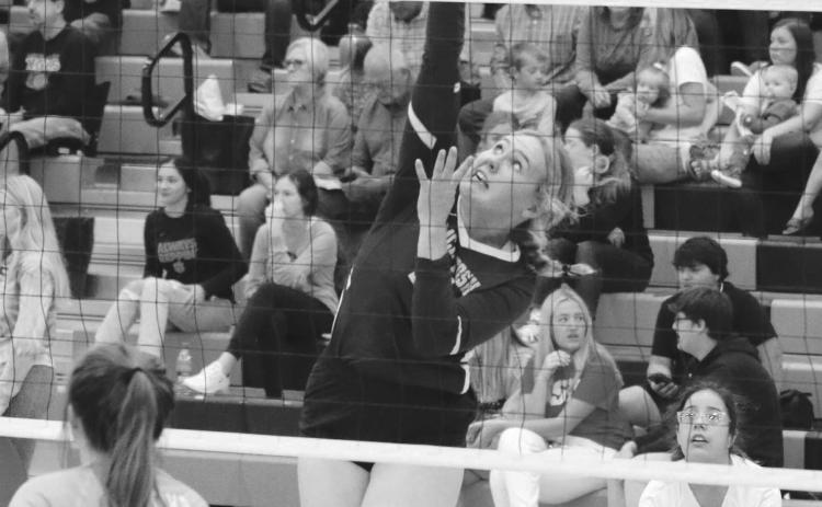 LEFT: Timber Lake’s Sara Holzer and Jasmine Nash attempt to block a spike from Herreid-Selby’s Pausha Meidinger during the Mobridge-Pollock Invitational on Saturday, Sept. 10. Looking on for Timber Lake is Carlie Lawrence (3). ABOVE: McIntosh senior Chloe Sandland hammers a spike against Cheyenne-Eagle Butte. Photos by Jon Flatland