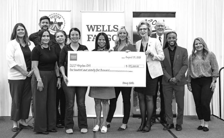 Attending the presentation of a check for $175,000 to Akiptan are Front, l-r: Dawn LeBeau, Akiptan; Skya Ducheneaux, Akiptan; Cristina Castro-Matukewicz, Wells Fargo; Maggie Reiffenberger, Wells Fargo; Patty Pannkuk, Wells Fargo; Jamal Spruiell, Wells Fargo; and Amanda Clark, Wells Fargo; Back: Melinda Reints, Wells Fargo; Bob Butterdrodt, Wells Fargo; Angie Marshall, FHLB Advisory Board; and Pete Mehlaff, FHLB Advisory Board.