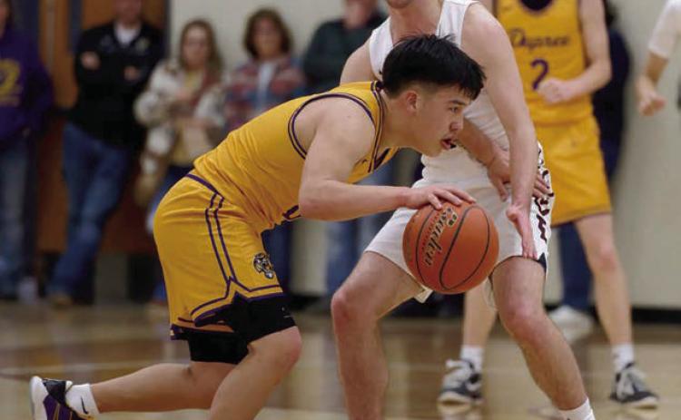 Dupreee guard Tre White Wolf attempts to dribble around the defense of Timber Lake’s Cole Ducheneaux during their meeting in the Region 8B quarterfinals last Thursday, March 6. Timber Lake pulled out a 56-53 win before a standing-room-only crowd to advance to the So Dak 16. The Panthers were playing Wessington Springs in Ft. Pierre as this issue of the Topic went to press. Photo by Marie DuPreez
