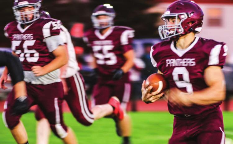 Panther senior Hank Kraft and the TL offensive line, including Dan Peterson (56) and AJ Lindskov (55), racked up the rushing offense against Newell in their homecoming game victory last Friday.