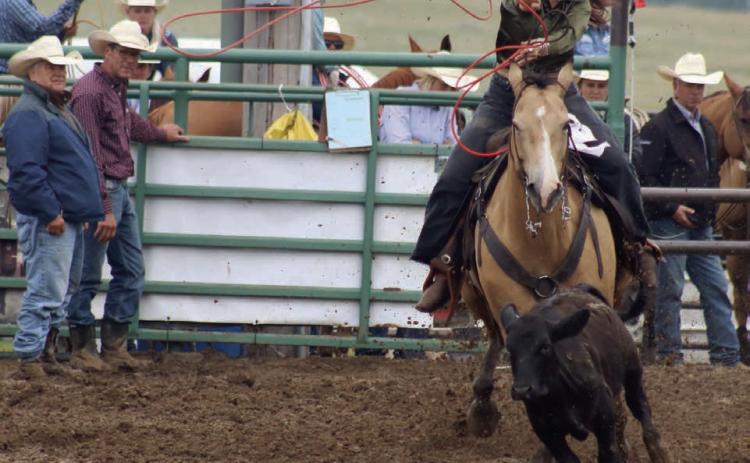 Acacia Anderberg of Mobridge throws her rope as she competes in the ladies breakaway event at the Isabel Rodeo on Saturday, Aug. 2. High winds, torrential rain and lightning forced the postponement of Friday night’s rodeo action until Saturday afternoon. Photo by Jon Flatland