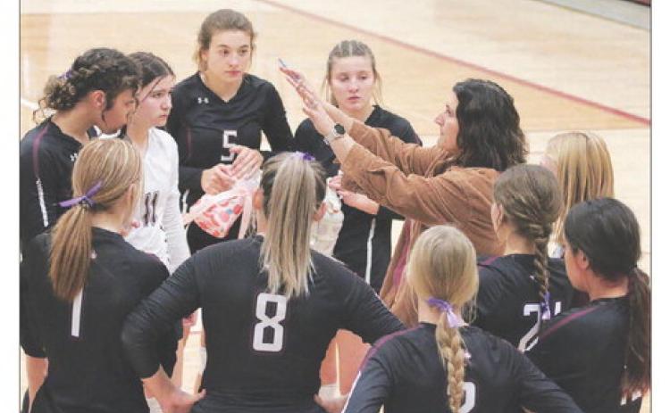 Timber Lake Lady Panther Head Coach Megan Bickel goes over strategy with her team between games of a match with the Newell Irrigators last Friday, Oct. 21. Timber Lake and Newell went into the game sitting one-and-two atop the Region 8B standings with the Lady Panthers winning a 3-game sweep to avenge a loss to the Irrigators in the championship match of the Little Moreau Conference Tournament in September. Photo by Jon Flatland