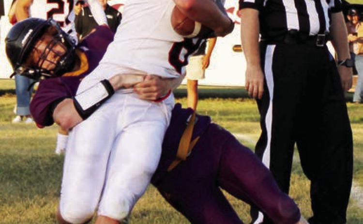 Dupree senior Fletcher Birkeland tackles a Lyman runner during the Tigers football seaaon opener. Dupree knocked off North Central last Friday, Aug. 29, and faces unbeaten Hill City this Friday, Sept. 5, in Hill City. The Rangers are 2-0 after lopsided wins over Stanley County and Lemmon-McIntosh.  Photo by Patty Peacock