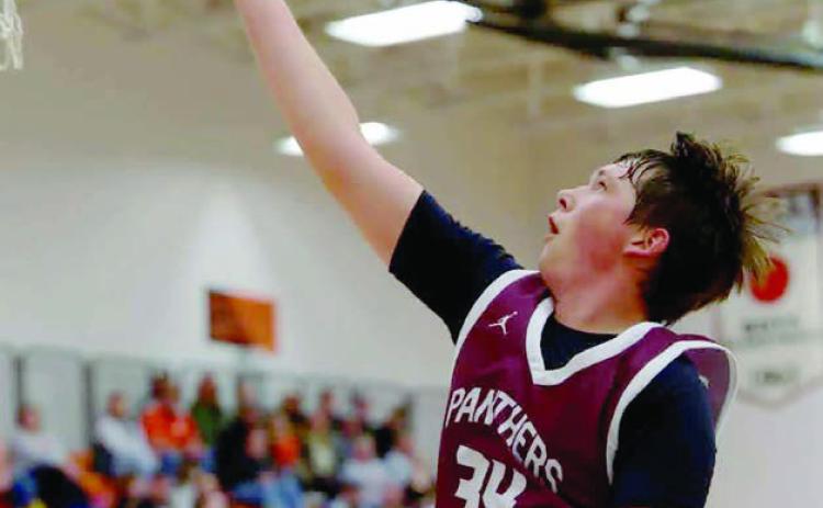 Timber Lake senior forward Rance Martin scored with a nifty finger- roll layup during recent boys basketball action against New Underwood. Photo by Marie DuPreez
