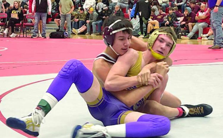 Timber Lake’s Sidney Morgan (left) works against Harding County’s Shay Smith in the 132-pound division of the Battler Wrestling Invitational in Gettysburg on Saturday, Jan. 18. Photo by Denise Perryman