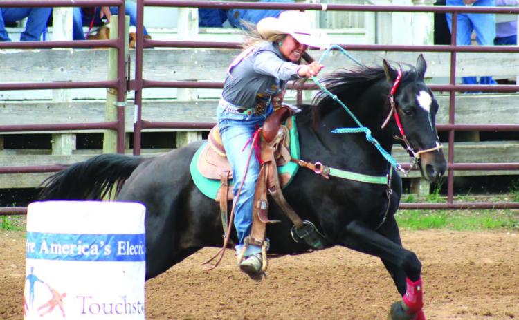 (Left) Charly Etzkorn of Dupree leads her horse around a barrel during the SDHSRA’s Northwest Region Rodeo in Dupree. Etzkorn missed the cut to qualify for state in barrels, but advances to compete in girls cutting, team roping and goat tying. Photos by Jon Flatland