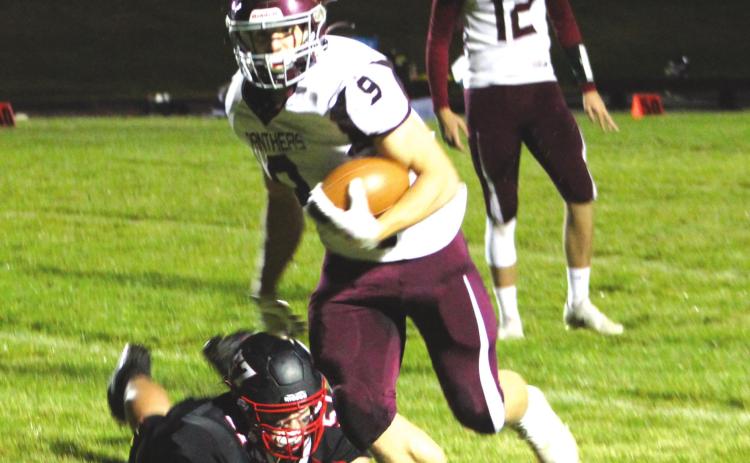 Senior running back Hank Kraft (9) made the game-winning catch on a pass from senior QB Kedrick Martin (12) to lift the Panthers over Lyman in the 9-man football playoffs. Photo by Ryan Deal