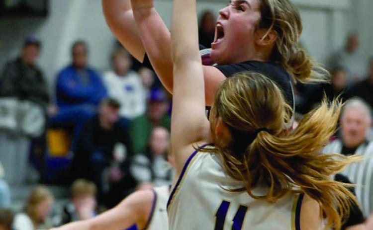 A determined Kate Biegler of Timber Lake takes the ball to the hoop while being defended by Sully Buttes guard Annaliese Van Zee during recent Lady Panthers girls basketball action. Photo by Marie DuPreez