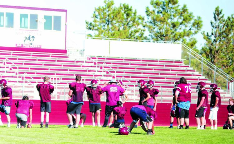 Head Coach Ryan Gimbel leads the Timber Lake Panthers through an offensive drill during practice at Doug Kraft Field on Monday. The Panthers will open their 2022 football season on Friday, Aug. 19, facing Lemmon-McIntosh in Lemmon. Photo by Jon Flatland