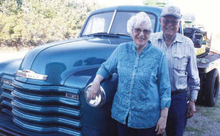 Harold and Lois Arnold of rural McIntosh will sell their collection of vintage vehicles on Saturday and don’t plan to keep even one “favorite.” Photo by Jon Flatland