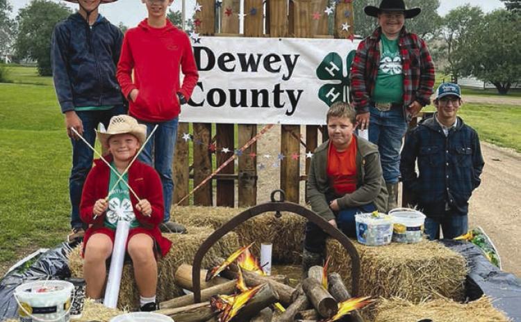 Top, the Western State Bank float in the Isabel Parade received the “Best of Show” award. Middle, members of American Legion Post 120 of Isabel destroyed damaged American flags in what became a very patriotic and emotional ceremony during the rodeo. Below, The Cordewzy 4-H Club won the award for “Best Youth Entry” in the Isabel Parade. Look for A LOT more photos on the Topic Facebook page! Photos by Jon Flatland and Denise Perryman
