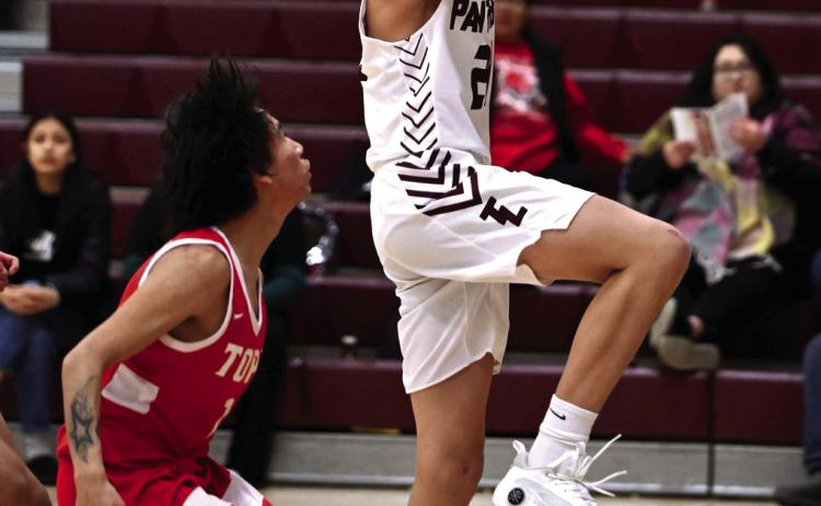 Freshman Kanton Hunt drives past a Tiospaye Topa defender for a layup during Timber Lake’s blowout win over the Thunderhawks last Thursday, Jan. 11. Hunt and teammate Tristan Dupris dropped a team-high 15 points each in the Panthers’ 83-26 victory. Timber Lake was scheduled to play in the Pheasant Shootout in Redfield on Jan. 13 but cancelled its appearance due to extreme cold. Photo by Marie DuPreez