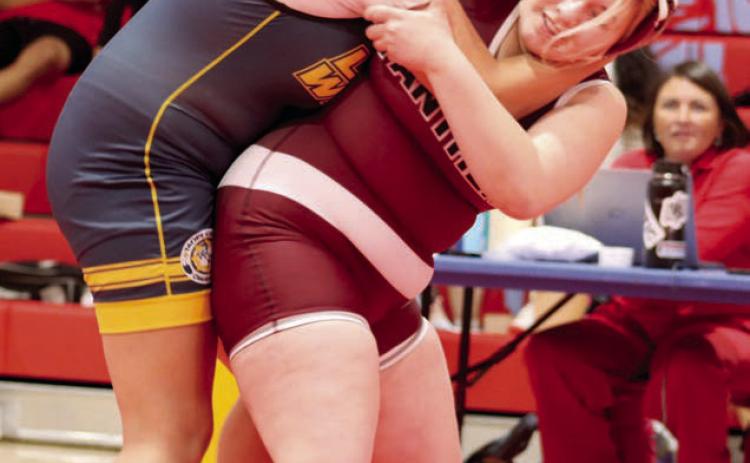 Timber Lake’s Lilly Veit begins a hip toss of her opponent Brealle Belt of Little Wound at the C-EB-Dupree Round Robin Tournament held Monday, Feb. 3, in Eagle Butte. Veit went on to pin Belt for the win. Photo by Jon Flatland