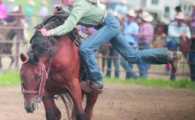Talley Locken of Isabel was able to avoid a potentially serious spill when her horse bucked as Locken was dismounting during the goat-tying event at the Ziebach County 4-H Rodeo on Saturday, July 15, in Dupree. Photo by Jon Flatland