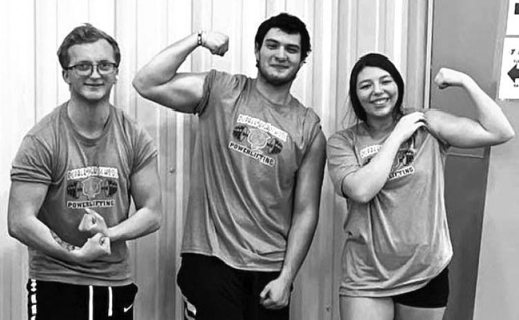 Dupree seniors competing in the West River Powerlifting Invitational included (l-r) Case DePoy, Matthew Lemke and Nevaeh Farlee. Lemke set one and Farlee set three new state records for their weight classes during the competition. Courtesy Photo