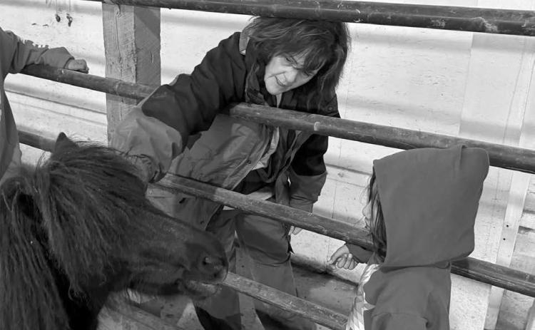 Bridget Williams introduces a child to a horse at Red Horse Healing in Rapid Valley, S.D., on Feb. 21, 2026. Photo by Bart Pfankuch
