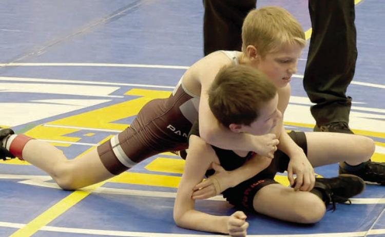 Barrett Hermes (top) works to get a hold on an opponent at the SDWCA Region 2 Youth Wrestling Tournament in Aberdeen on Sunday, March 15. Eighteen members of the Timber Lake Youth Wrestling Club advanced to compete in the State Tournament March 28-30 in Rapid City. Photo by Mikki Veit