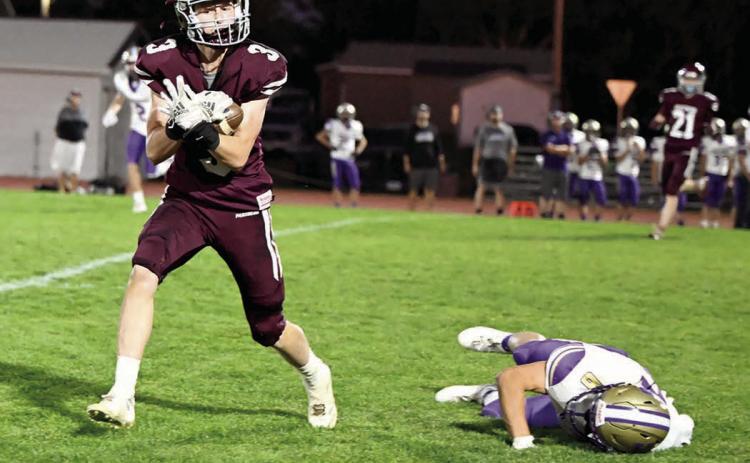 Timber Lake wide receiver Holden Gill pulls in a pass behind a fallen Harding County-Bison defender that turned into an 80-yard catch-and-run touchdown during second quarter action at Doug Kraft Field last Friday, Sept. 27. Gill finished the game with three receptions for 104 yards and the TD. The Ranchers claimed a 44-12 win over the Panthers, who drop to 3-2 on the season. Timber Lake travels to Lemmon-McIntosh this Friday, Oct. 4. Photo by Marie Du Preez