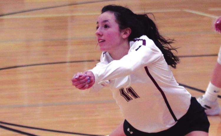 LEFT: Timber Lake senior Rachel Toviah lunges to make a play on a serve from Faulkton Area during their SoDak 16 round game.
